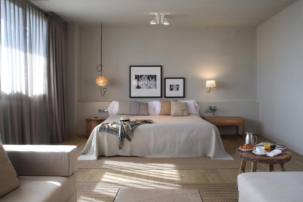 Spacious hotel room with a double-sized bed