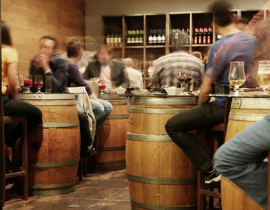 Barrels of wine used as tablets at a tapas bar